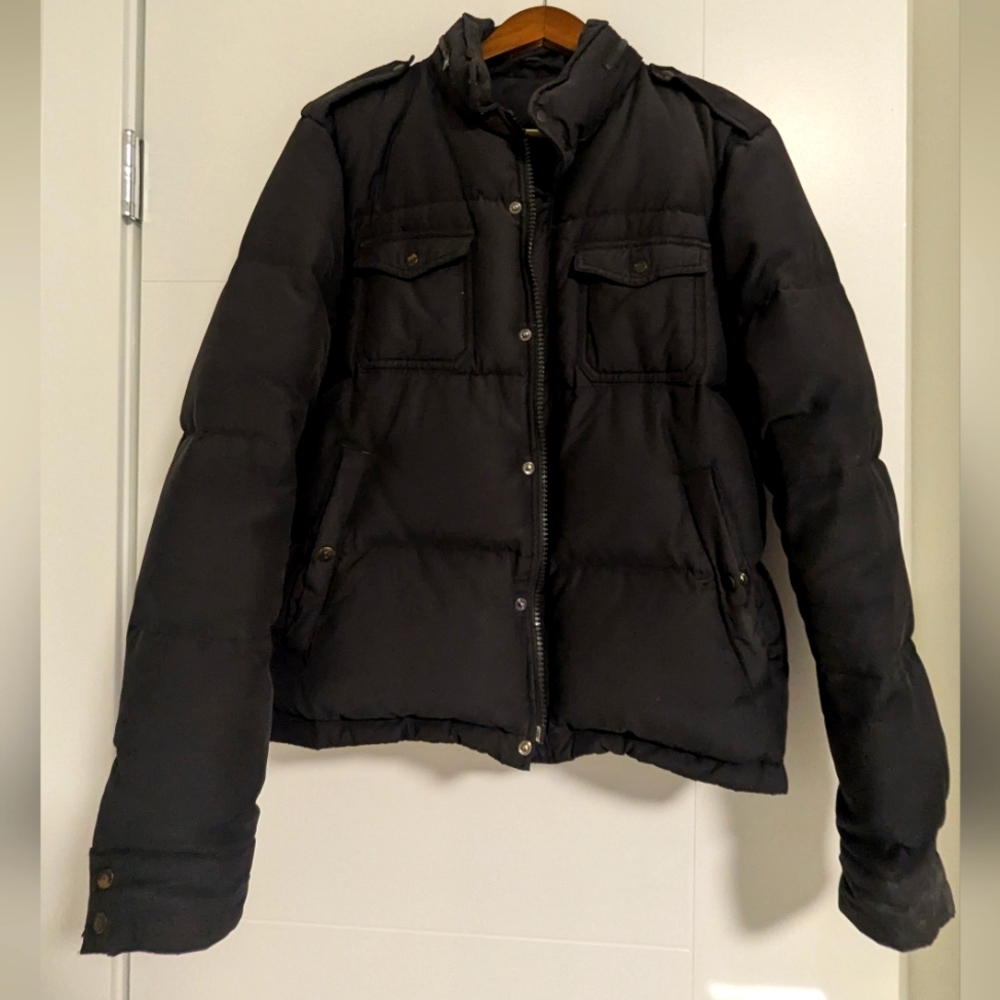 Thick pile down puffer jacket. Military inspired with epaulets on shoulders.